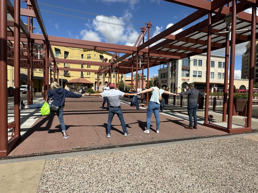 a group of colleagues doing a city chase team building activitiy in chicago