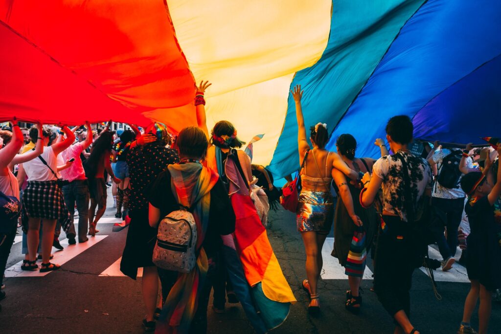 a group of people celebrating pride month