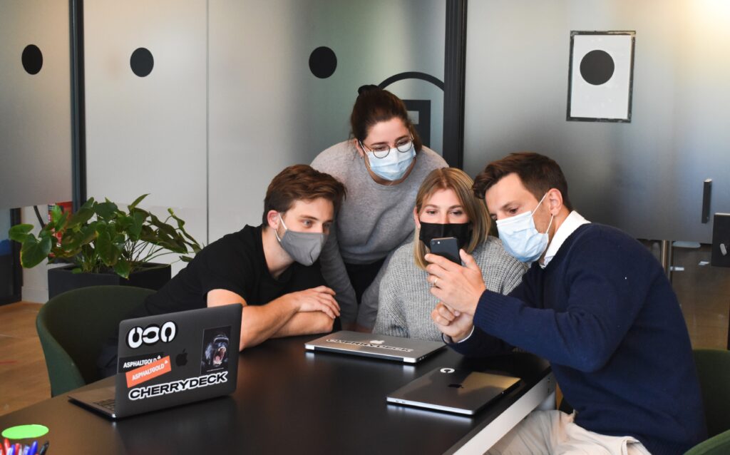 teammates having a meeting in a conference room