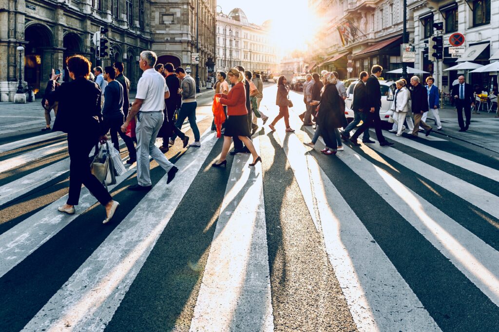 people walking around a big city