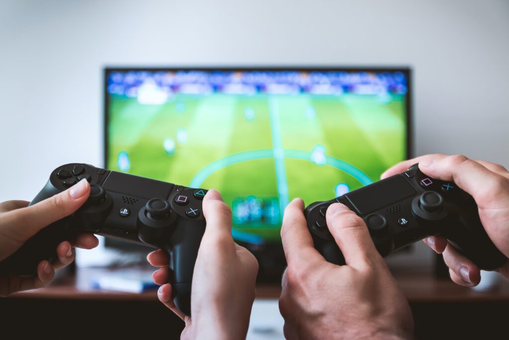 hobby-themed team building questions section image with two people playing playstation