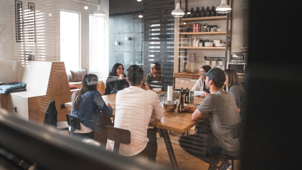 teammates having a meeting in a hybrid work environment