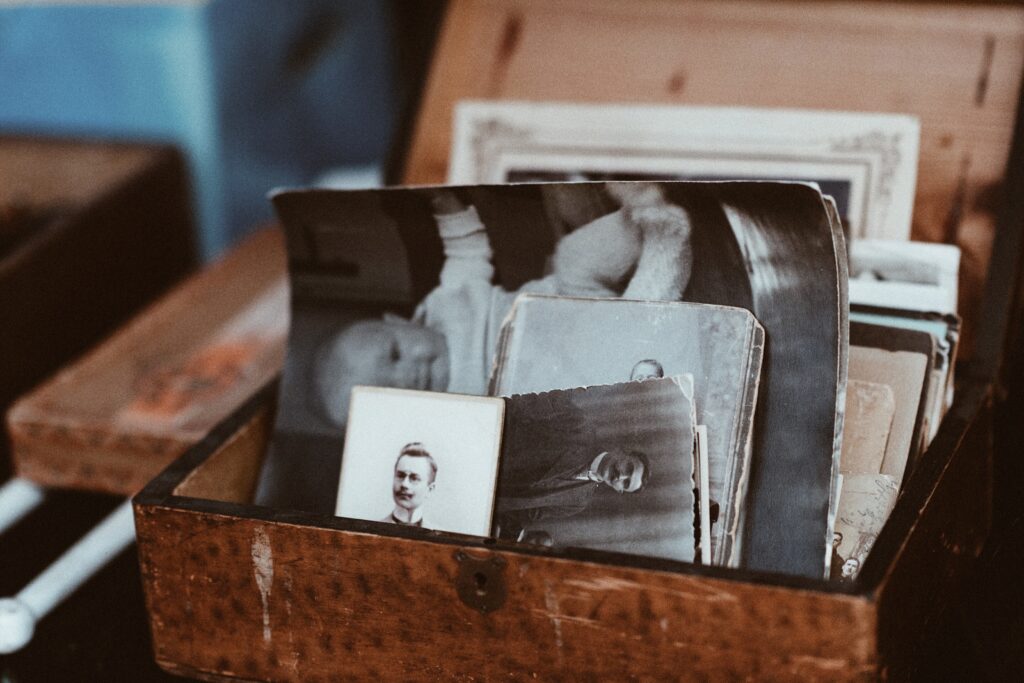 History-themed team building questions section image with chest filled with old photos