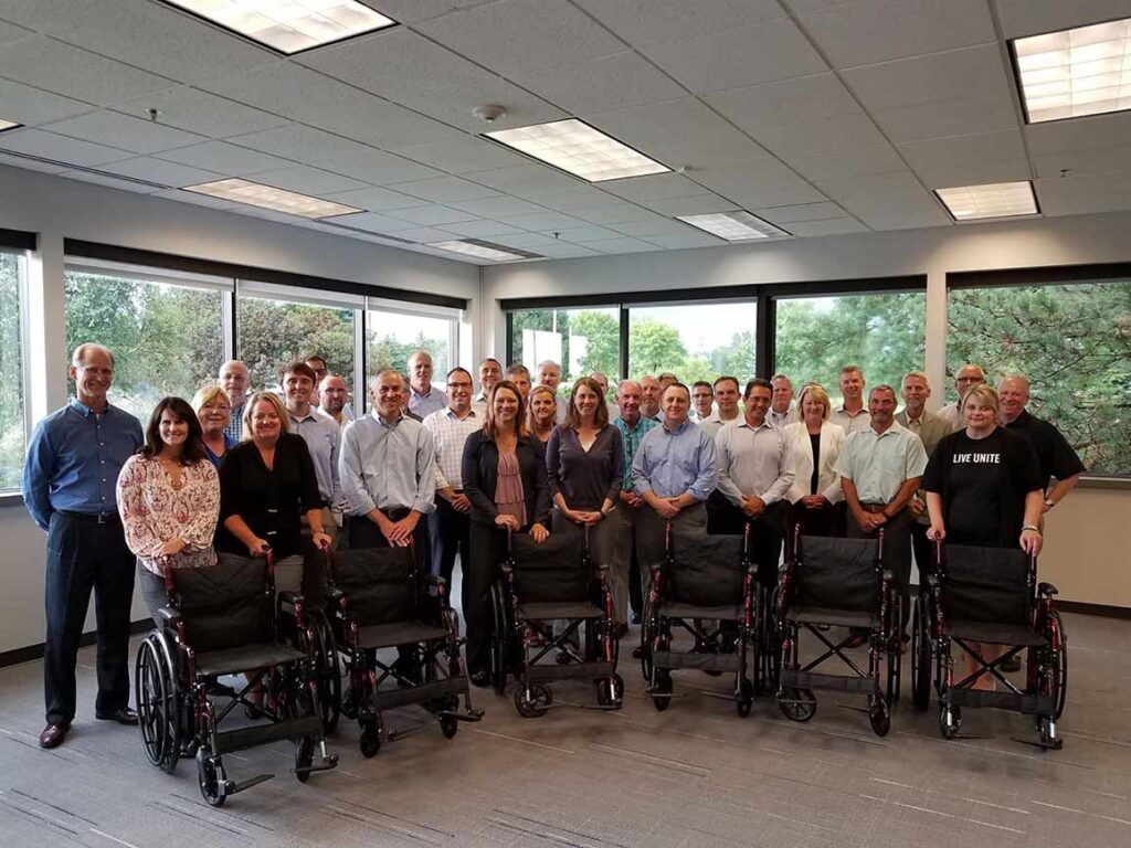 wheelchairs for charity is a great collaborative philanthropic team building activity for senior leaders